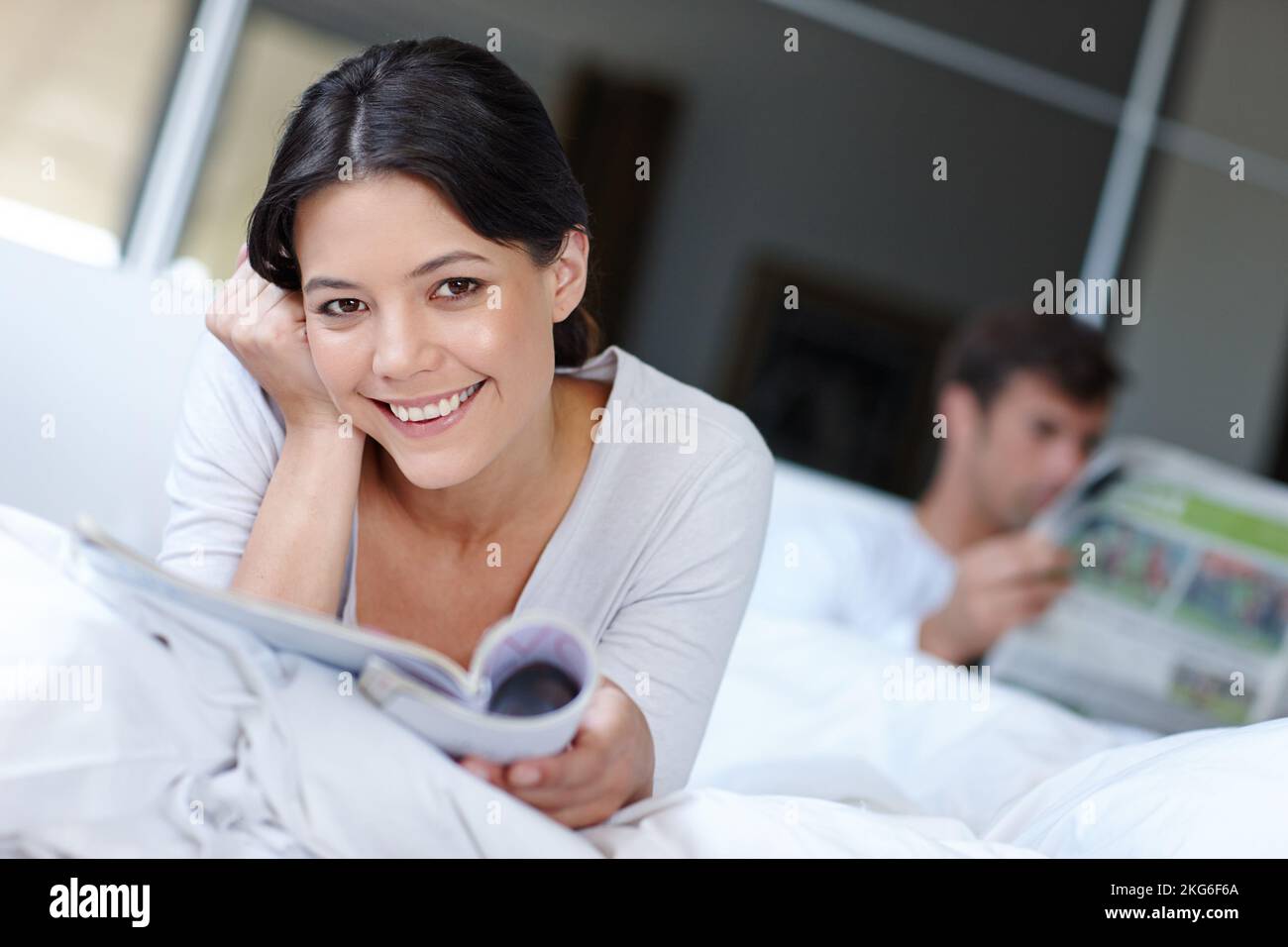 Beautiful woman lying in bed hi-res stock photography and images - Alamy