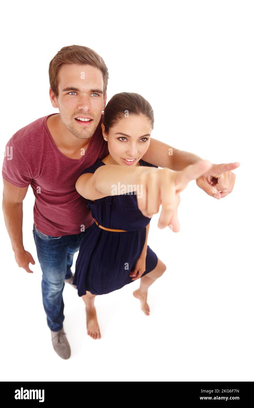 Dont press the button. High angle shot of an attractive couple pointing upwards. Stock Photo