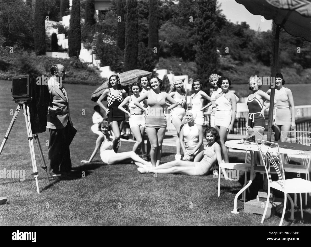 JUDITH ALLEN and WAMPAS Baby Stars of 1934 (including LUCILLE LUND and JACQUELINE WELLS / later JULIE BISHOP who both appeared in THE BLACK CAT with Boris Karloff and Bela Lugosi) pose in swimsuits for Still Cameraman in YOUNG AND BEAUTIFUL 1934 director JOSEPH SANTLEY screenplay and dialogue Dore Schary producer Nat Levine Mascot Pictures Stock Photo
