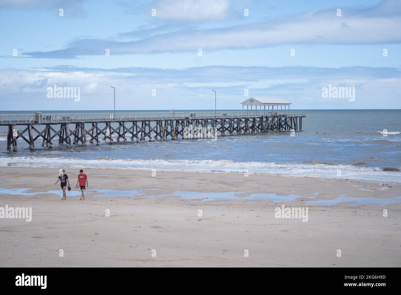 Adelaide, Australia. 22 November 2022.  Swimmers  on deserted beach in Adelaide, South Australia  on a mild sunny day following several days of unsettled weather  with below average temperatures for November. Credit: amer ghazzal/Alamy Live News Stock Photo