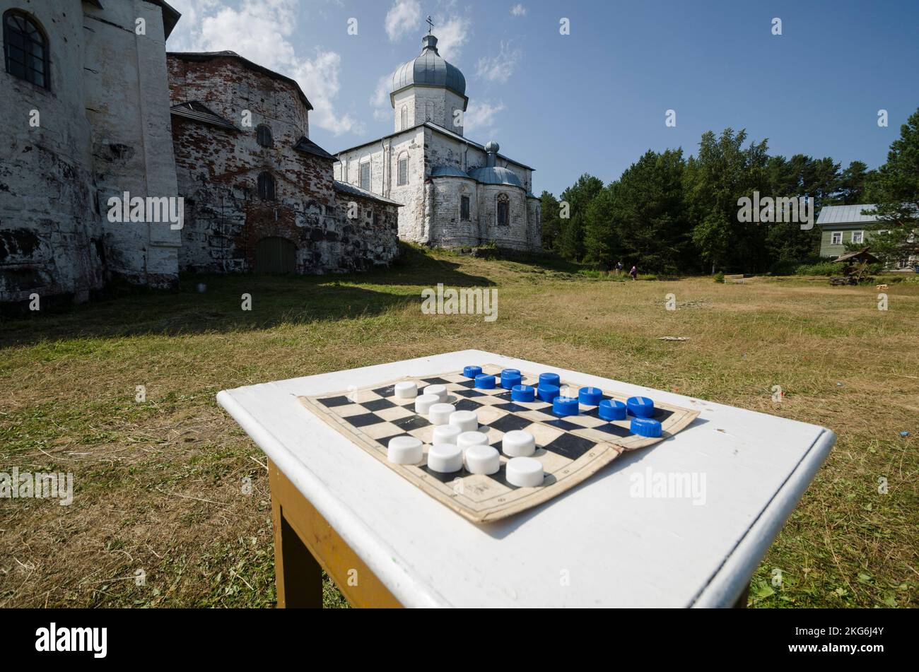 Checkerboard on the background of an ancient monastery. Kiy Island Stock Photo