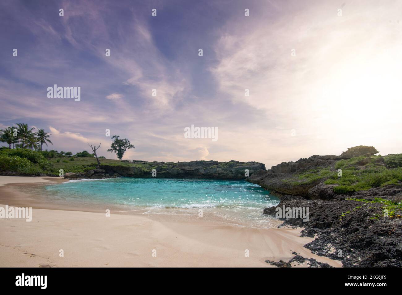 Sandy beach with the blue ocean and sunset sky background Stock Photo ...