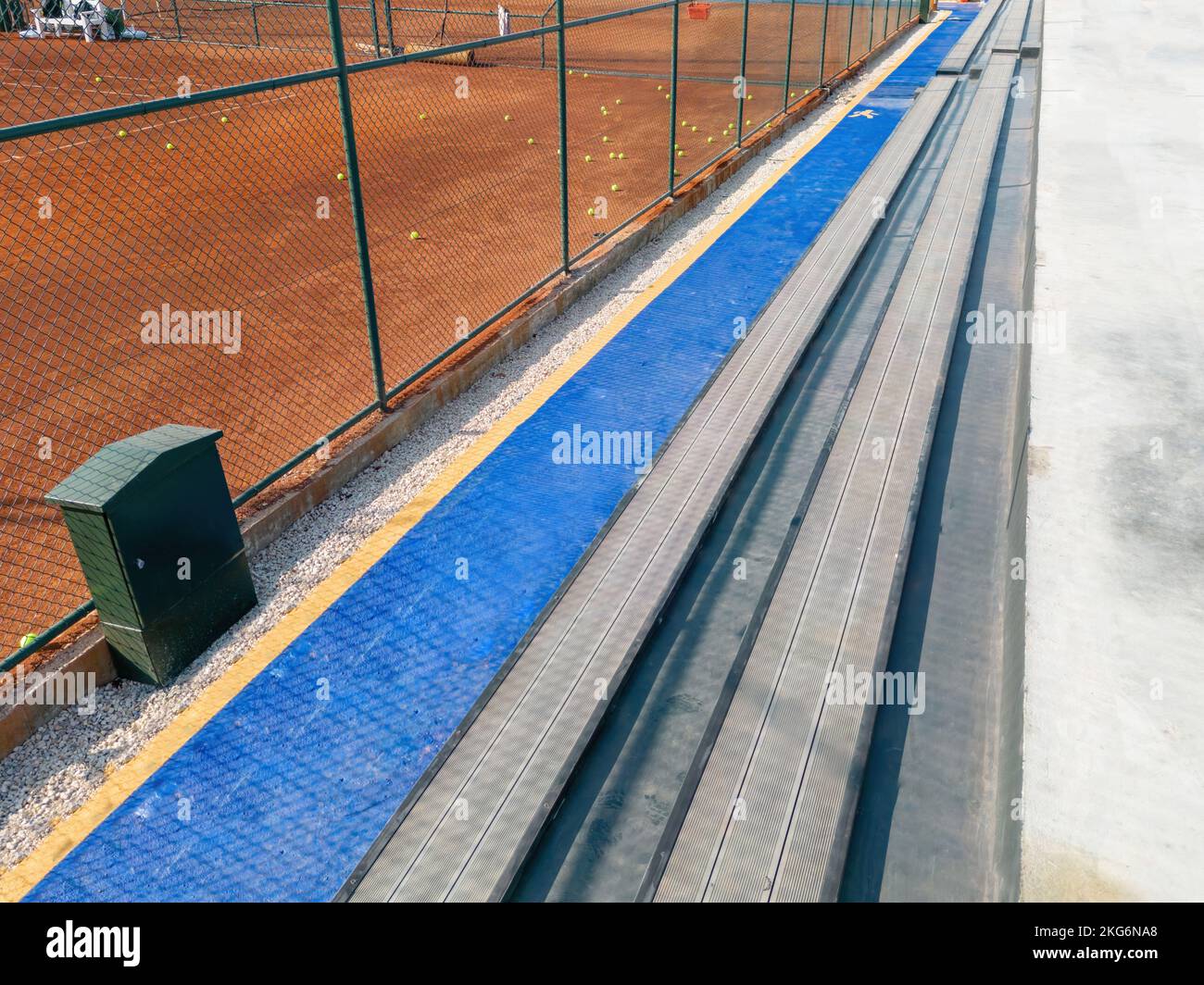 Seating area for spectators made with composite deck next to the tennis