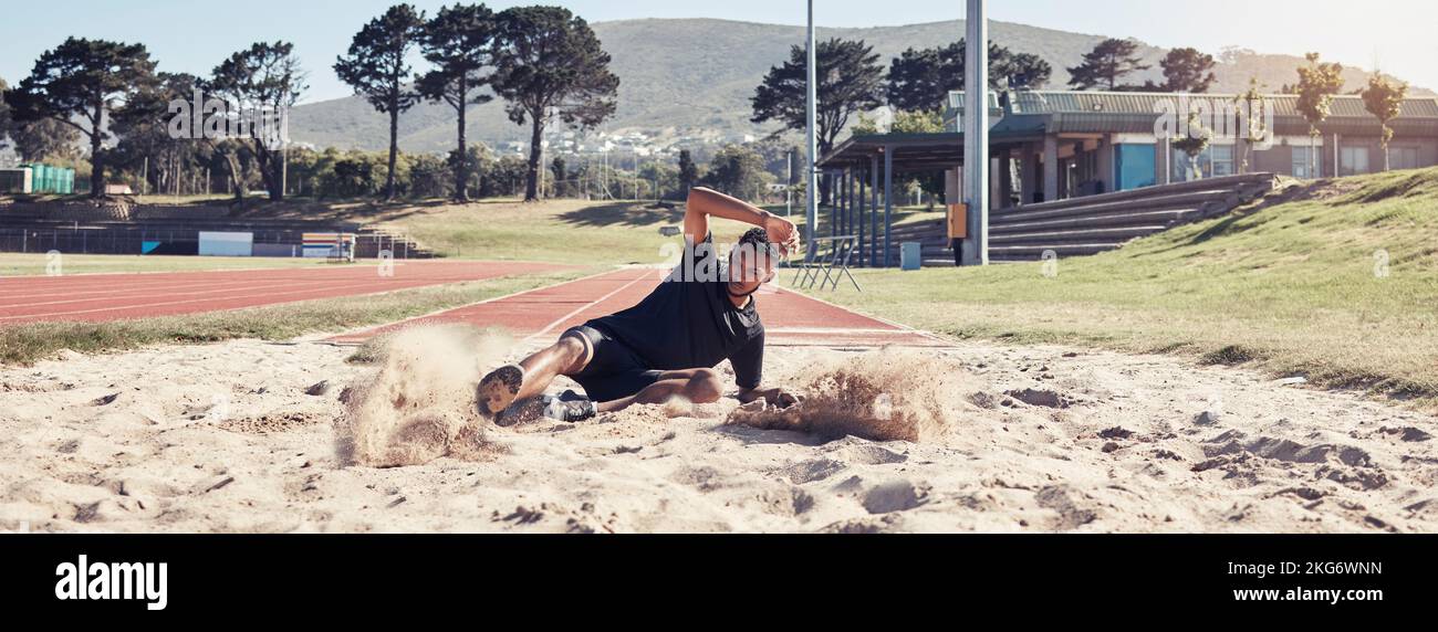 Athlete long jump, sand and sports man training for France olympic competition, workout challenge or fitness exercise. Winner mindset, commitment and Stock Photo
