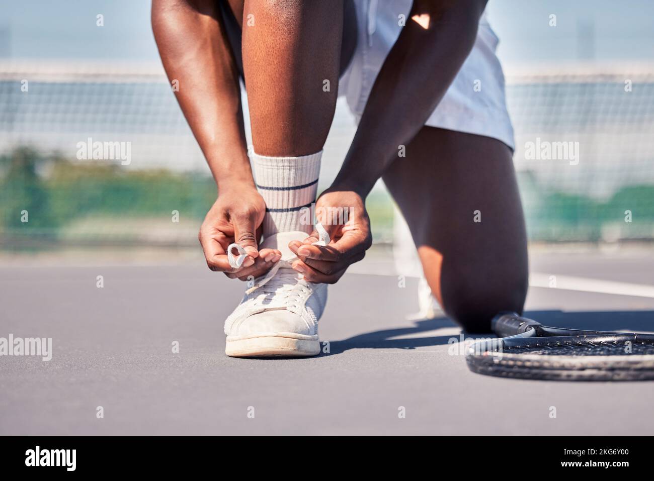 Sports, tennis and man tie shoes before game start, competition or fitness exercise on outdoor tennis court. Wellness health, ground and legs of Stock Photo