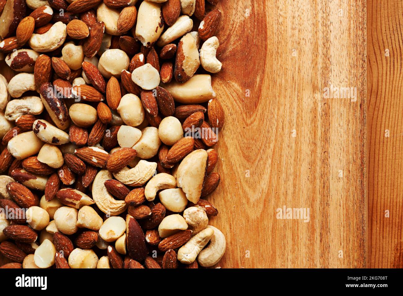 Nuts about nuts. High angle shot of an assortment of nuts on a wooden table. Stock Photo