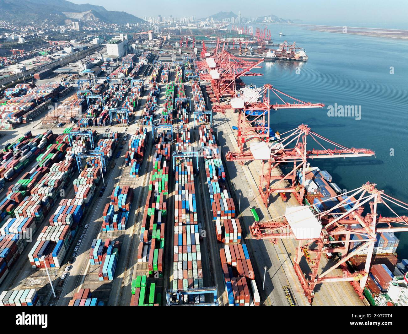 Aerial photos show cargo ships loading and unloading containers at the ...