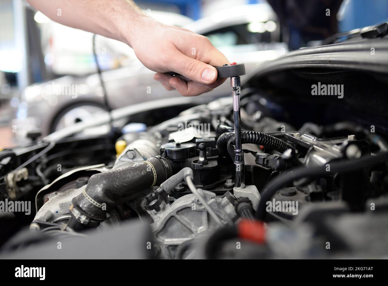 To Repair job and workplace - mechanic in a workshop repairing a car Stock Photo ...
