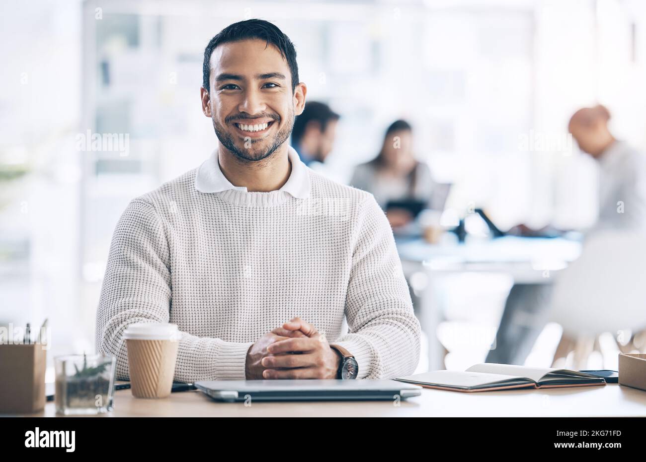 Smile, marketing and businessman happy in a coworking office at a corporate agency. Ready, excited and portrait of an employee working at a desk with Stock Photo