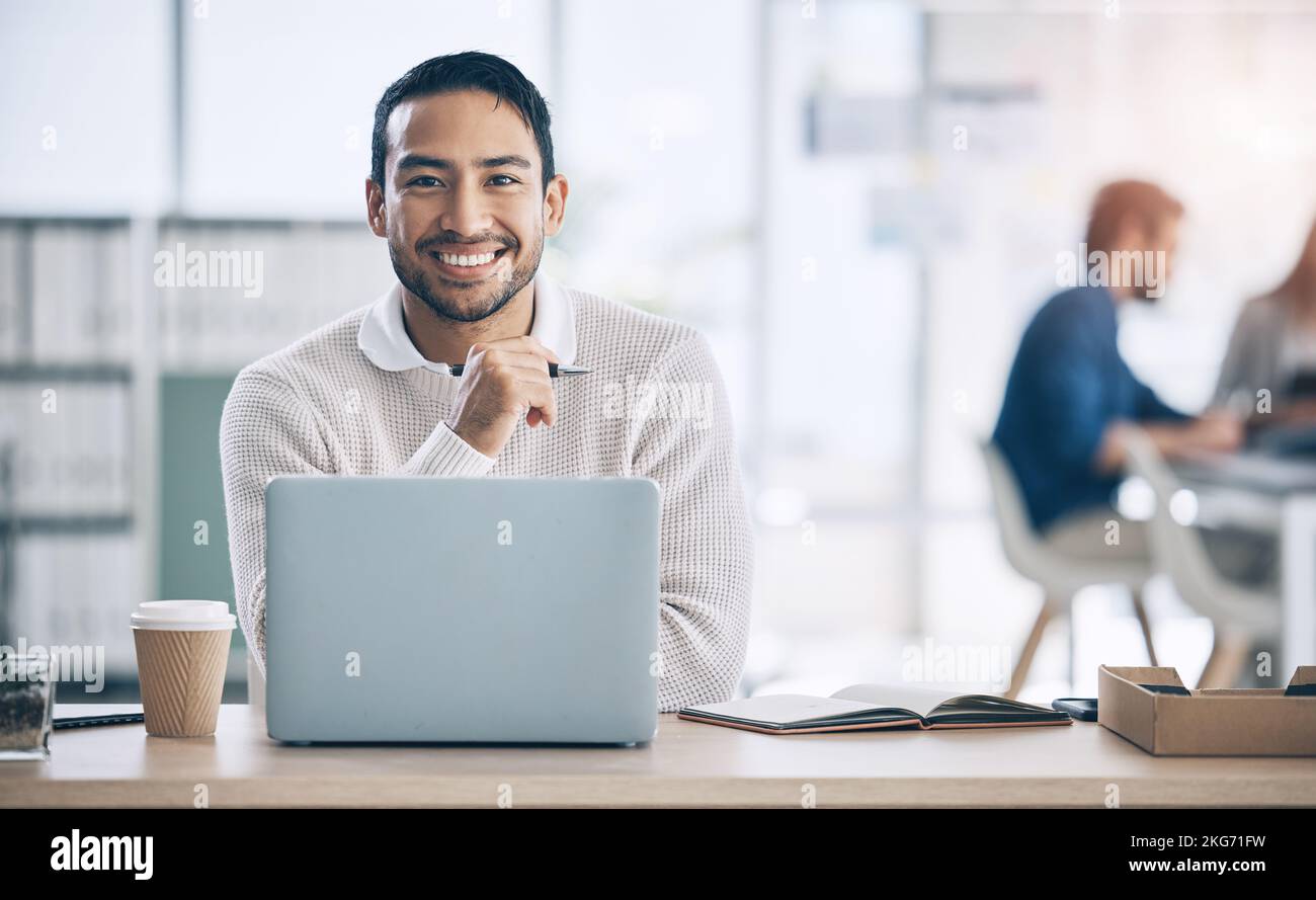 Laptop, office and portrait of Asian businessman with smile on face for confidence, leadership and success. Startup, tech and male entrepreneur ready Stock Photo