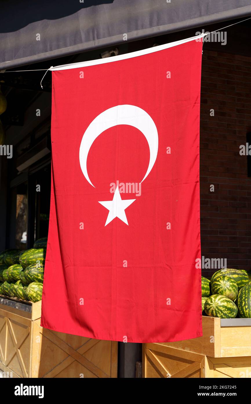 Turkish flag background. Red textile flag of Turkey on the streets of Istanbul on the holidays of patriotism and independence of the republic. Culture, nation, state. High quality photo Stock Photo