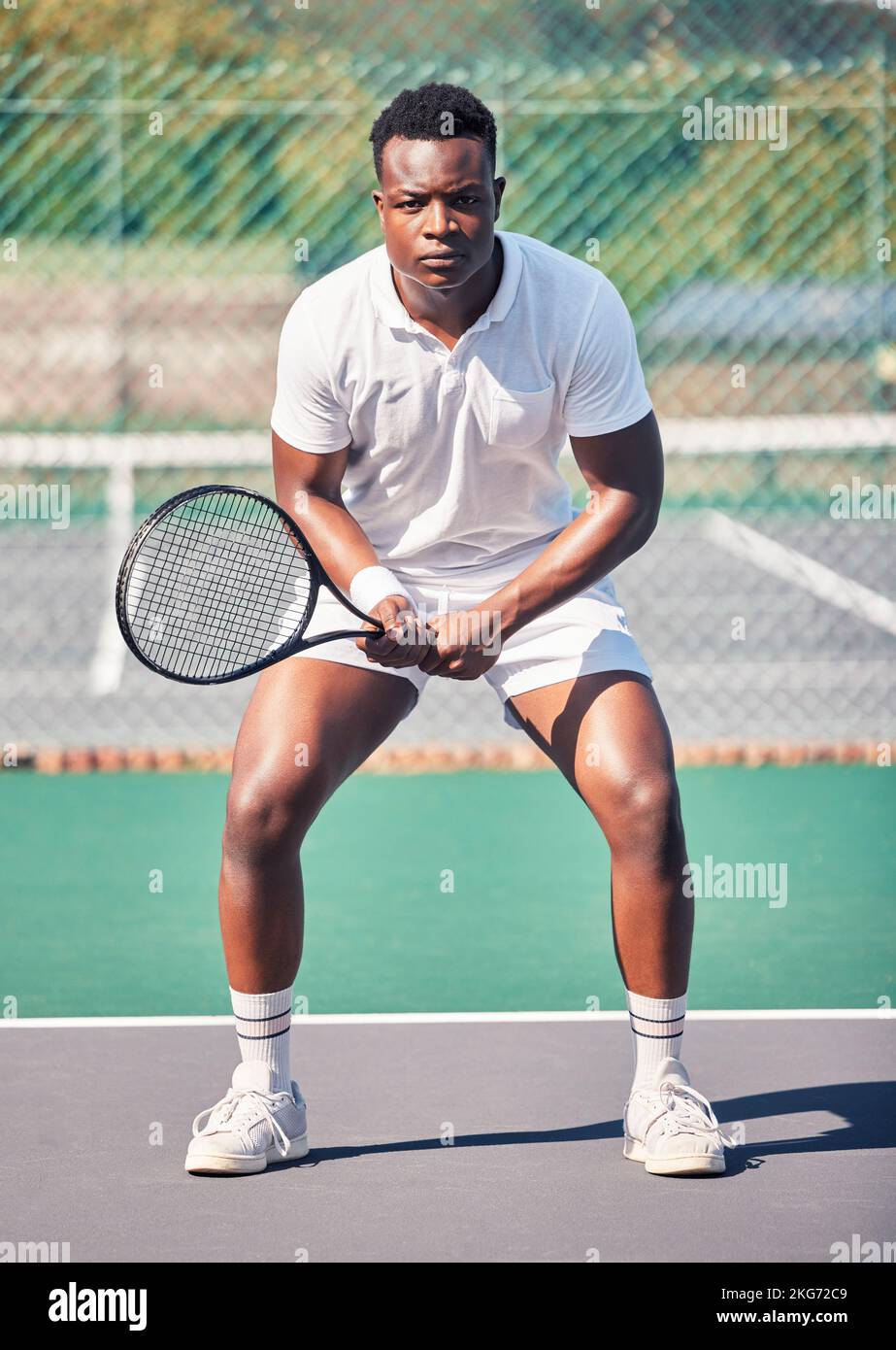 Tennis, sports and black man in portrait for game, competition and training with focus, power and energy wellness. Strong, athlete and fitness african Stock Photo