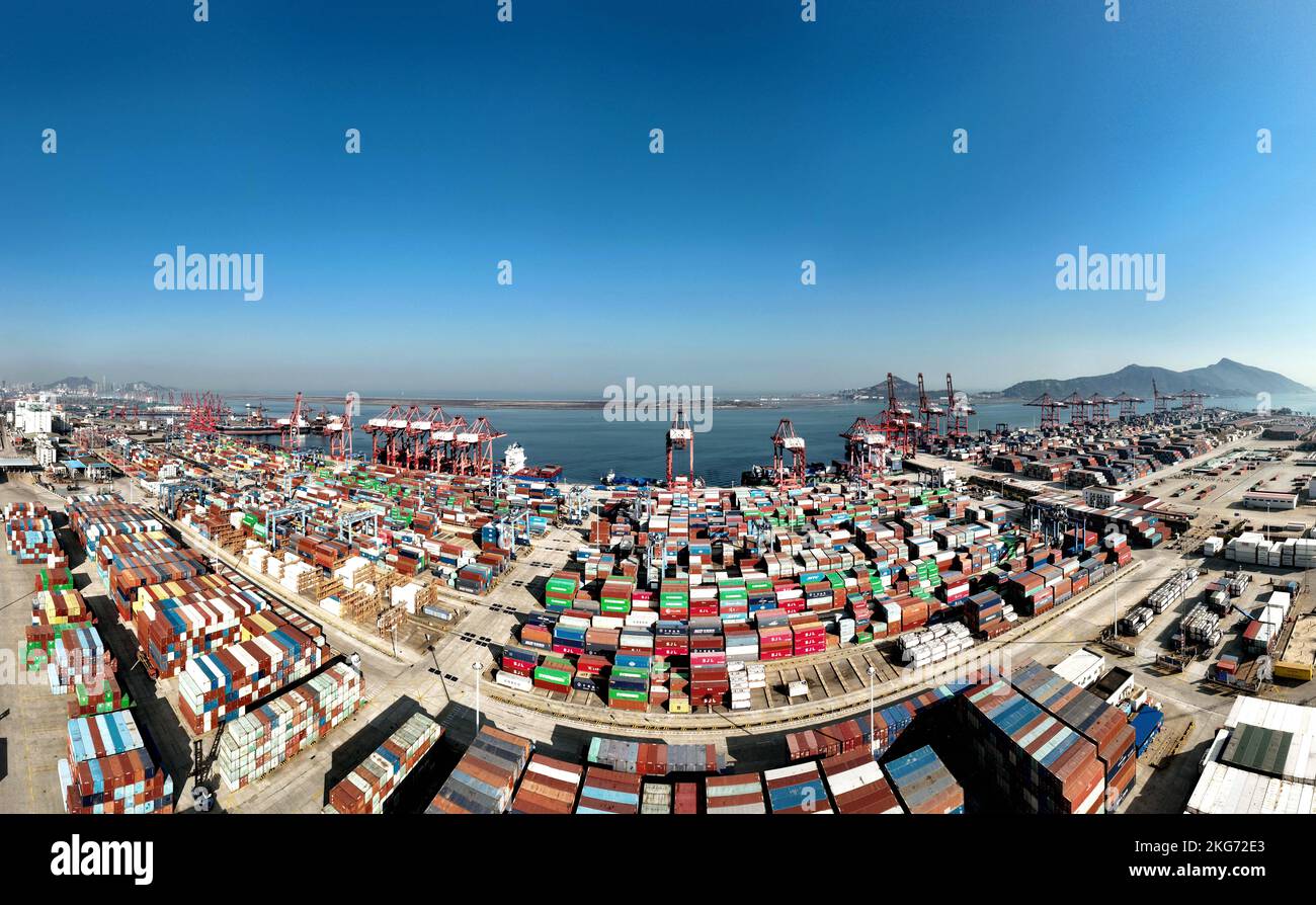 Aerial photos show cargo ships loading and unloading containers at the ...