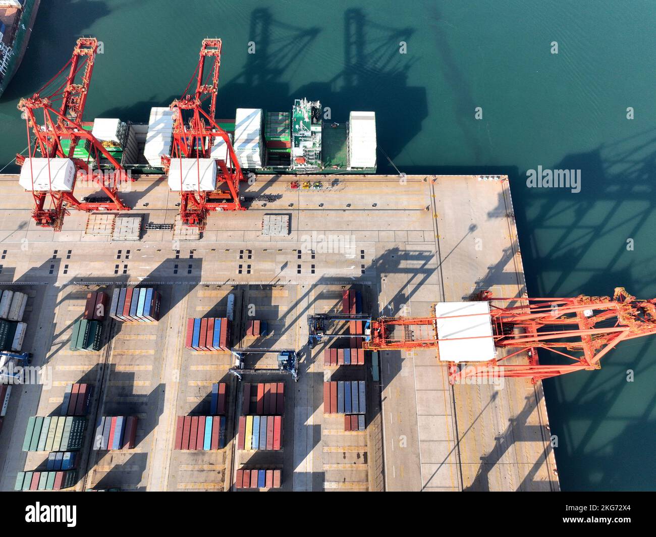 Aerial photos show cargo ships loading and unloading containers at the ...