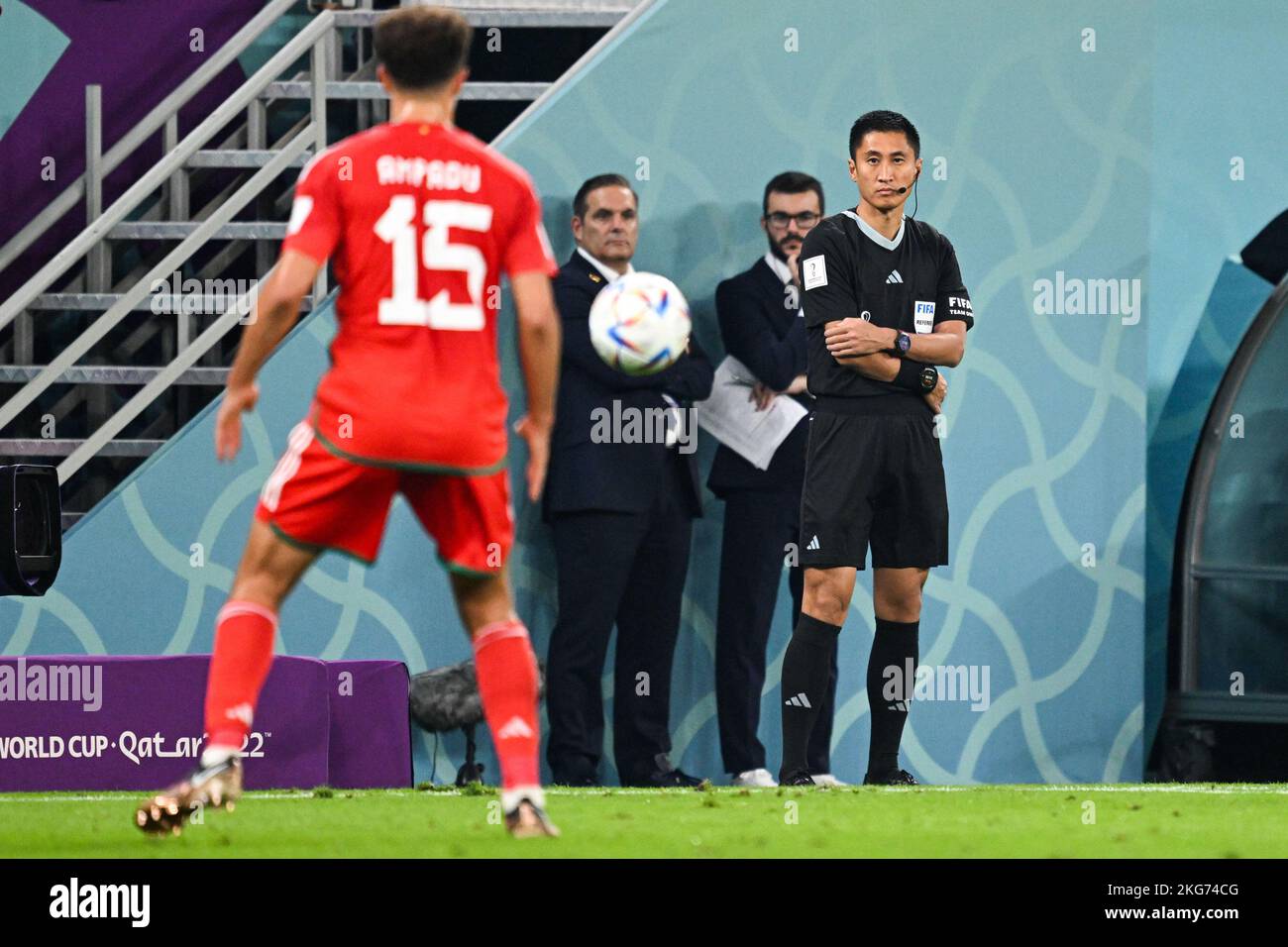 Chinese referee Ma Ning is serving as the fourth official in the 2022