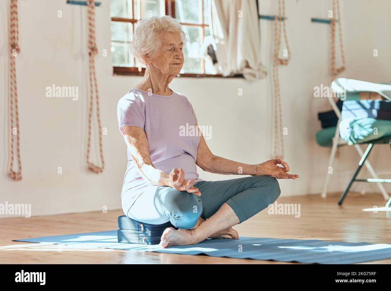 Elderly woman, yoga meditation and wellness while sitting on floor in ...