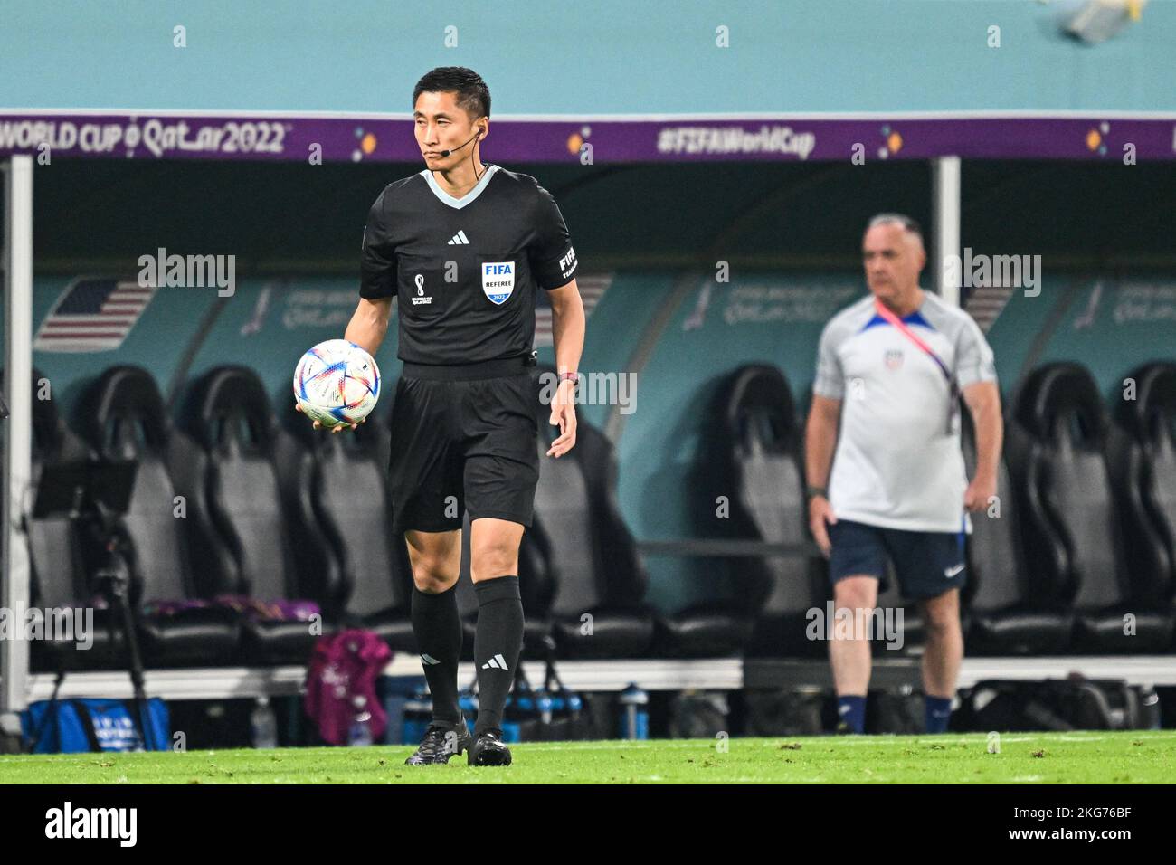 Chinese referee Ma Ning is serving as the fourth official in the 2022