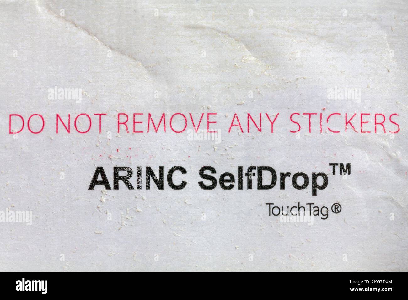Do not remove any stickers ARINC SelfDrop Touch Tag on reverse of Easyjet luggage label Stock Photo