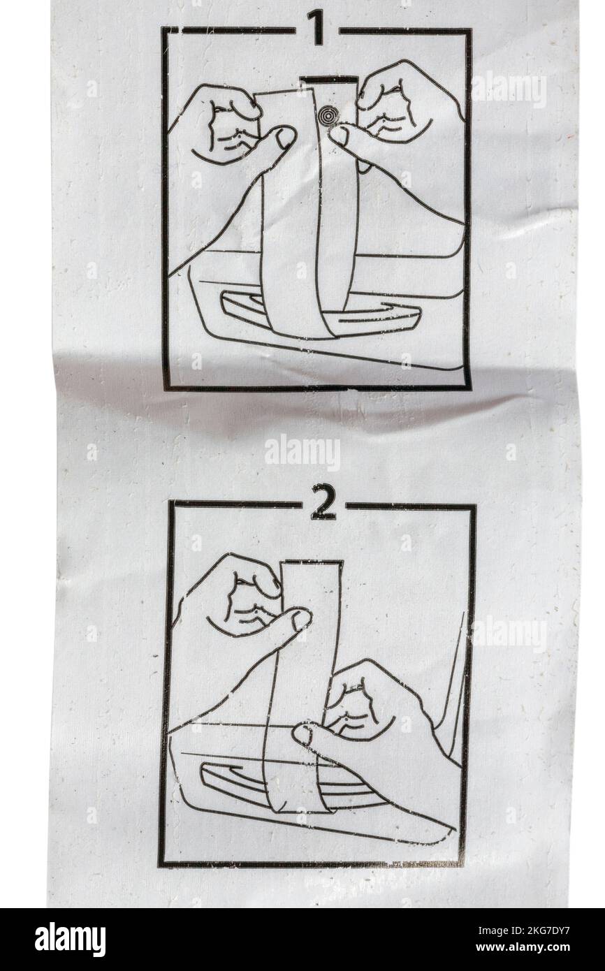 Align the dots to stick the label securely on baggage hires stock
