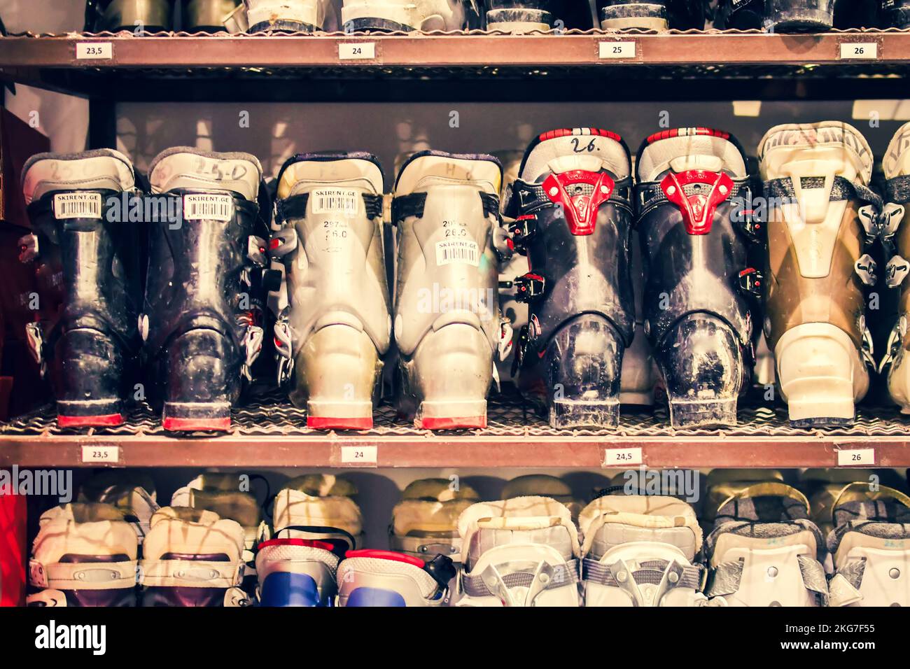 Various ski boots in ski rental shop for rental on ski resort for