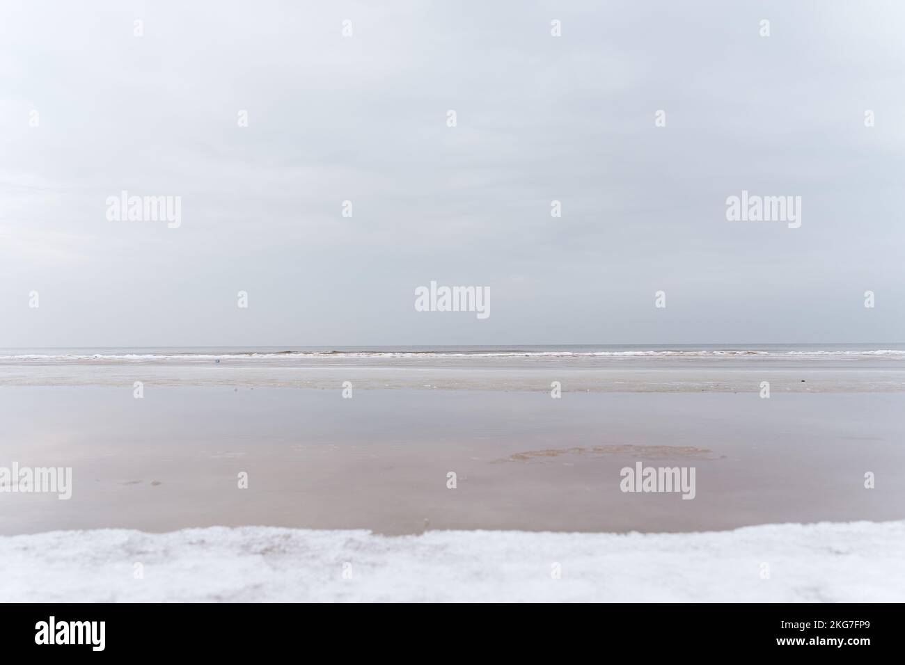Winter seascape in the middle of a cloudy day. Baltic sea, Jurmala, Latvia. Stock Photo
