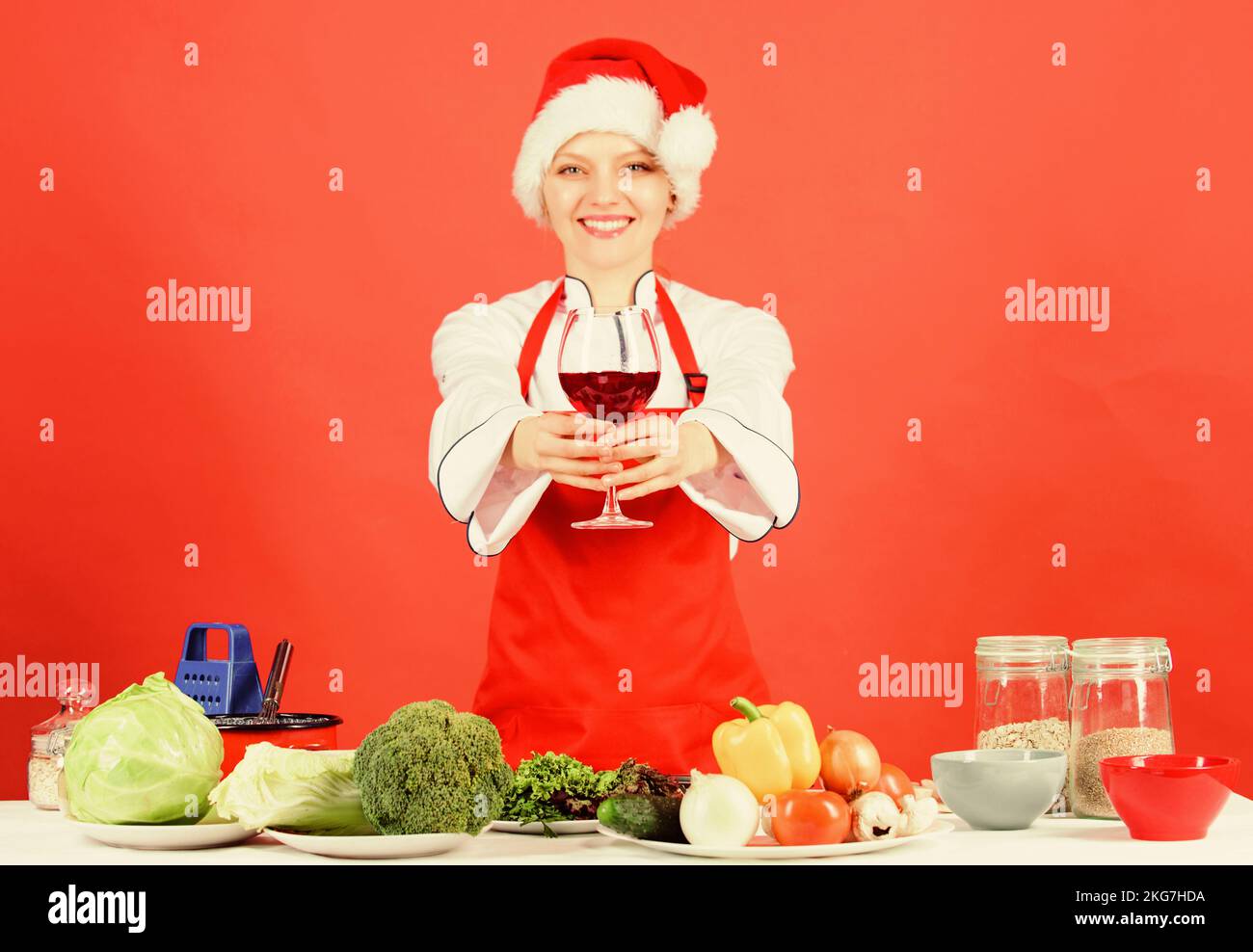 Christmas menu. No stress. Woman chef cooking wear santa hat drink wine ...