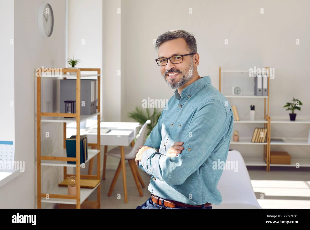 Successful middle-aged business man looking at camera with confident expression on his face. Stock Photo