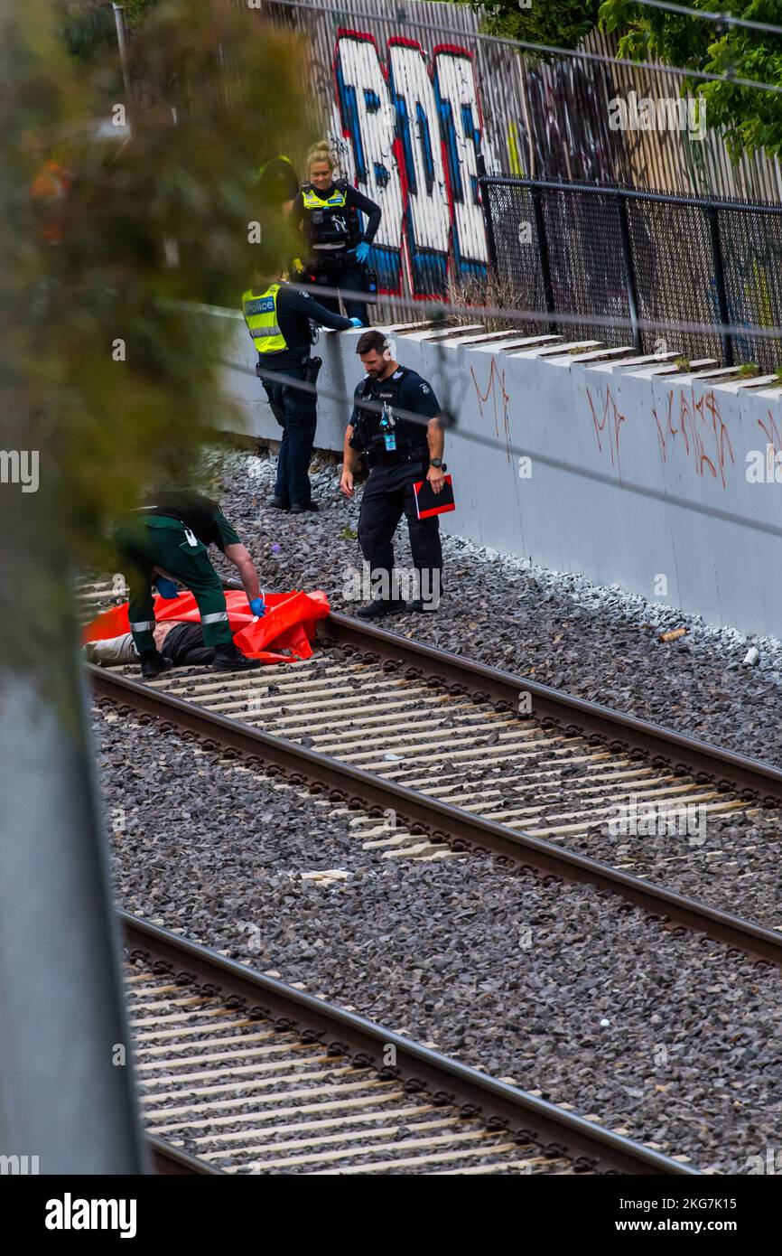 (EDITORS NOTE Image depicts death) Coroner's office personnel and