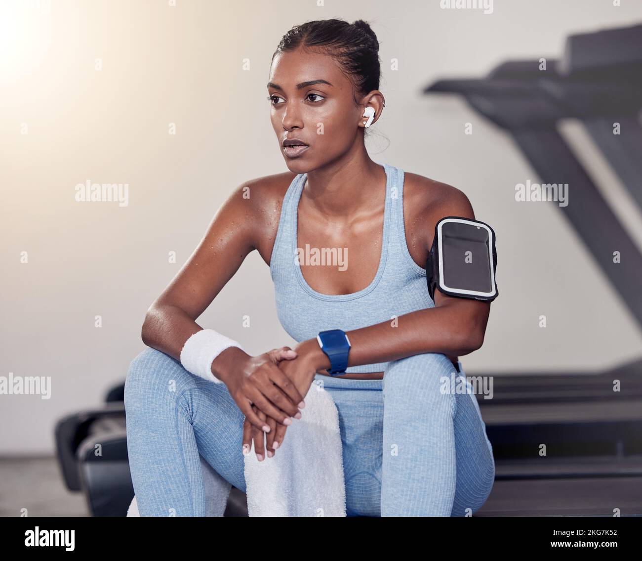 Fitness, woman and break in sweat from running exercise, cardio workout or training on treadmill at the gym. Tired female relaxing after intense Stock Photo