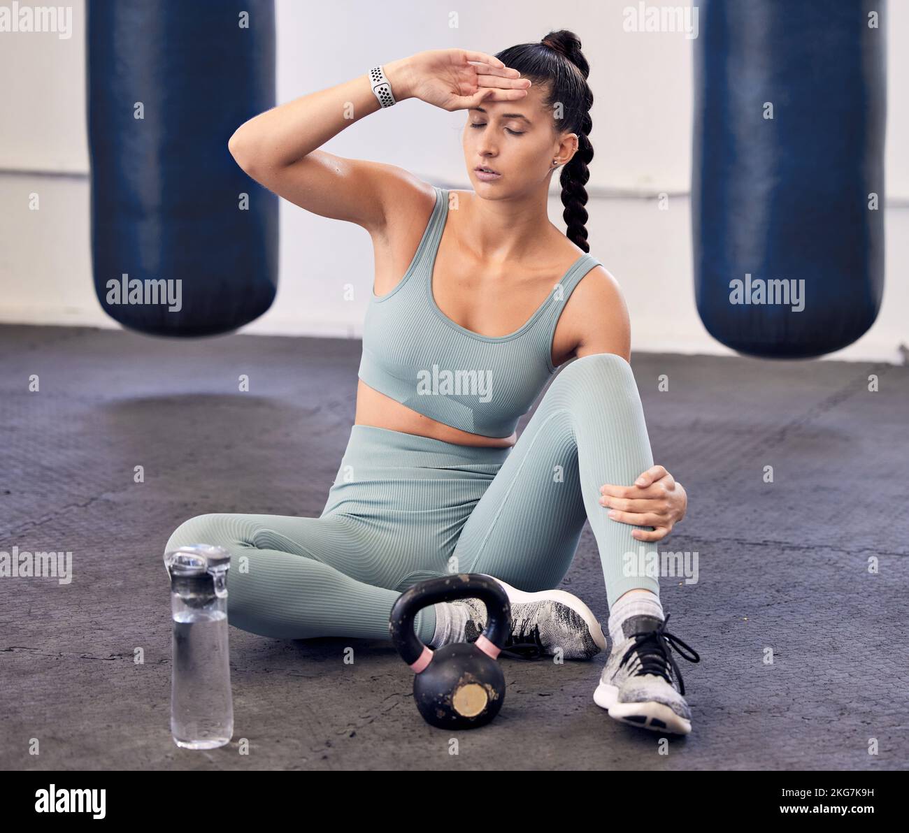 Fitness, tired and woman with burnout or headache, break and relax