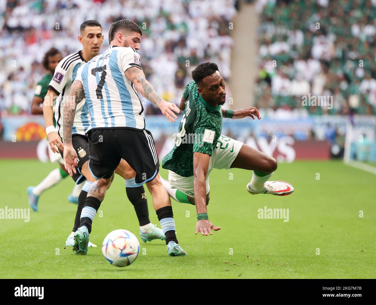 Lusail, Qatar. 22nd Nov, 2022. Mohamed Kanno (R) of Saudi Arabia vies with Rodrigo de Paul (C) of Argentina during the Group C match between Argentina and Saudi Arabia at the 2022 FIFA World Cup at Lusail Stadium in Lusail, Qatar, Nov. 22, 2022. Credit: Cao Can/Xinhua/Alamy Live News Stock Photo