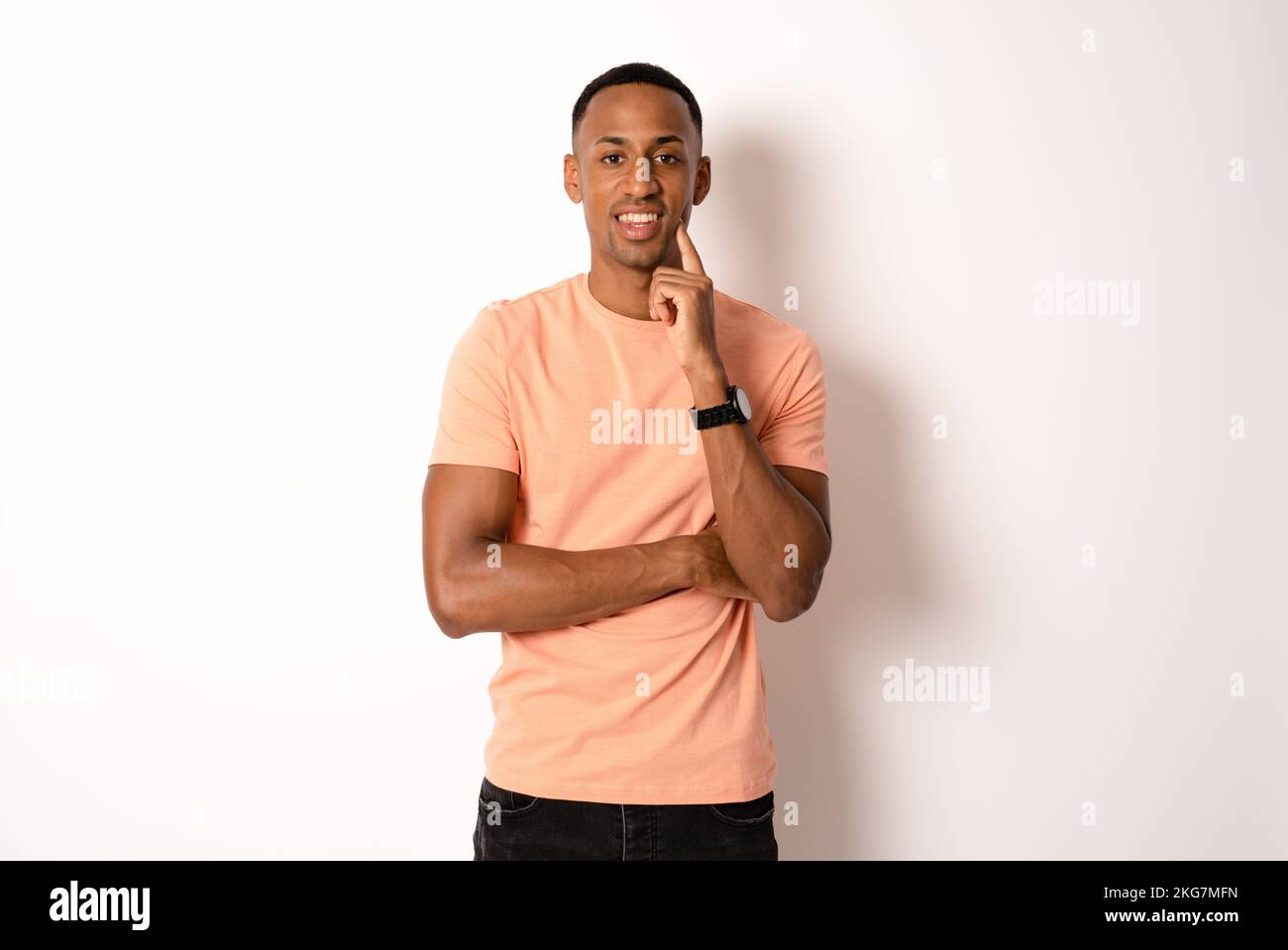 young man thinking isolated over white background. Stock Photo