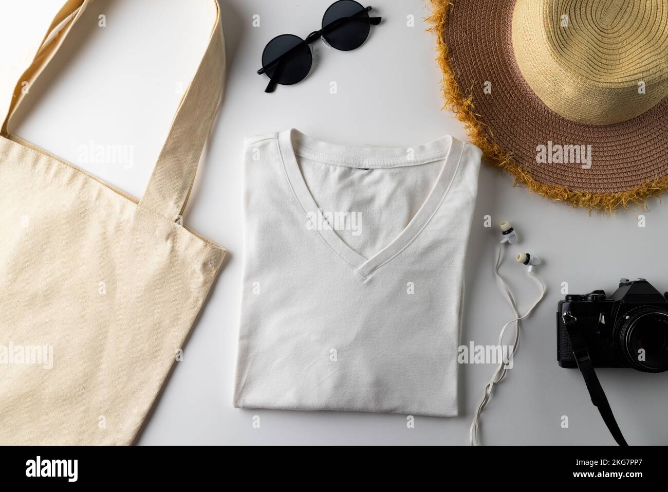 Close up of tshirt and summer equipment on white background Stock Photo