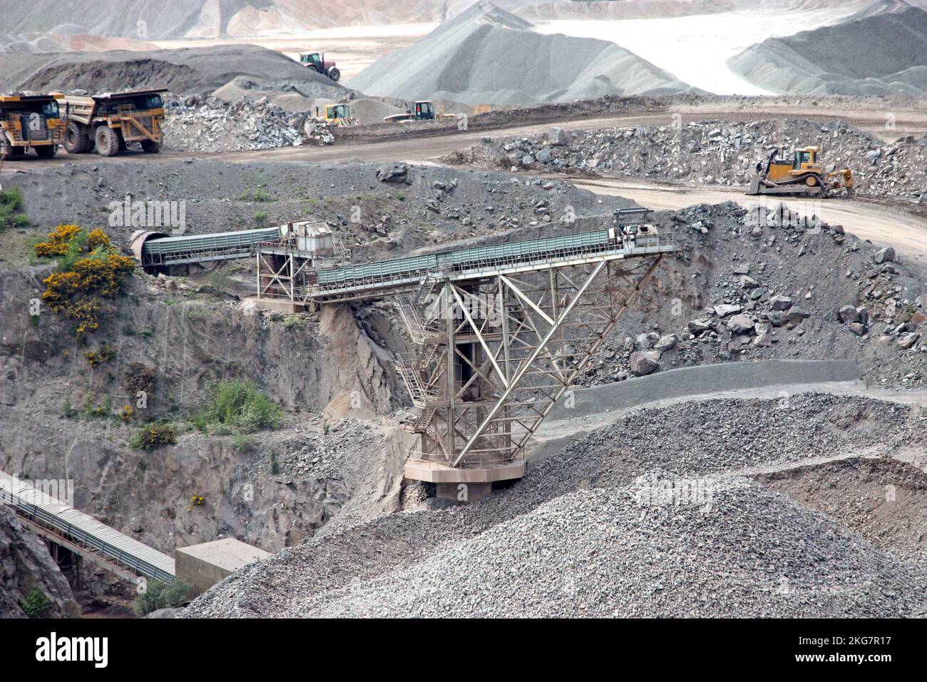 Conveyors and Vehicles at a Granite Stone Quarry. Stock Photo