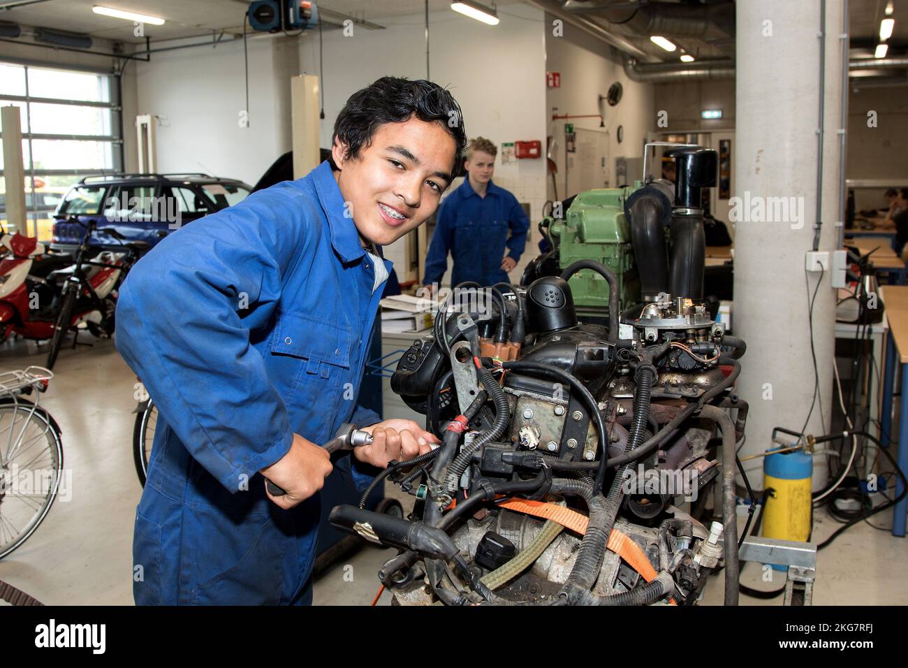 secondary school student working on a car engine. 2018 holland ...