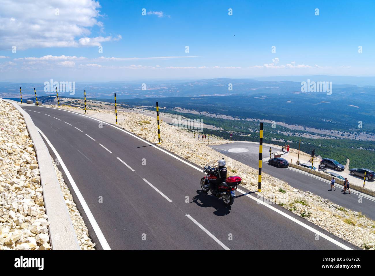 BEDOIN, FRANCE - AUGUST 7, 2022: Motorcyclist on the top of Mont Ventoux. At 1,909 m (6,263 ft), it is the highest mountain in the region and has been Stock Photo