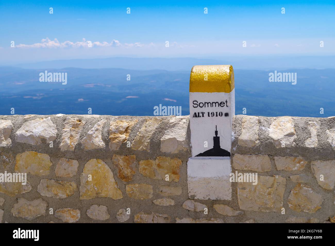 marker stone on top of the Mont Ventoux, France. At 1,909 m (6,263 ft), it is the highest mountain in the region and has been nicknamed the 'Beast of Stock Photo