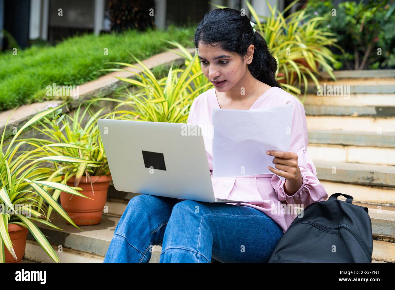 young student at college campus buys working on project using laptop - concept of learning or exam preparation, knowledge and hard-working Stock Photo