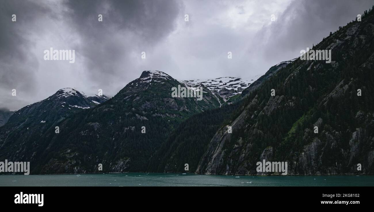 An aerial view of lake surrounded by greenery mountains Stock Photo - Alamy