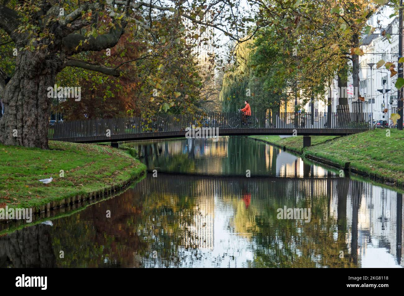 Rotterdam, The Netherlands, November 12, 2022: bridge for pedestrians and cyclists acros Westersingel canal in autumn Stock Photo