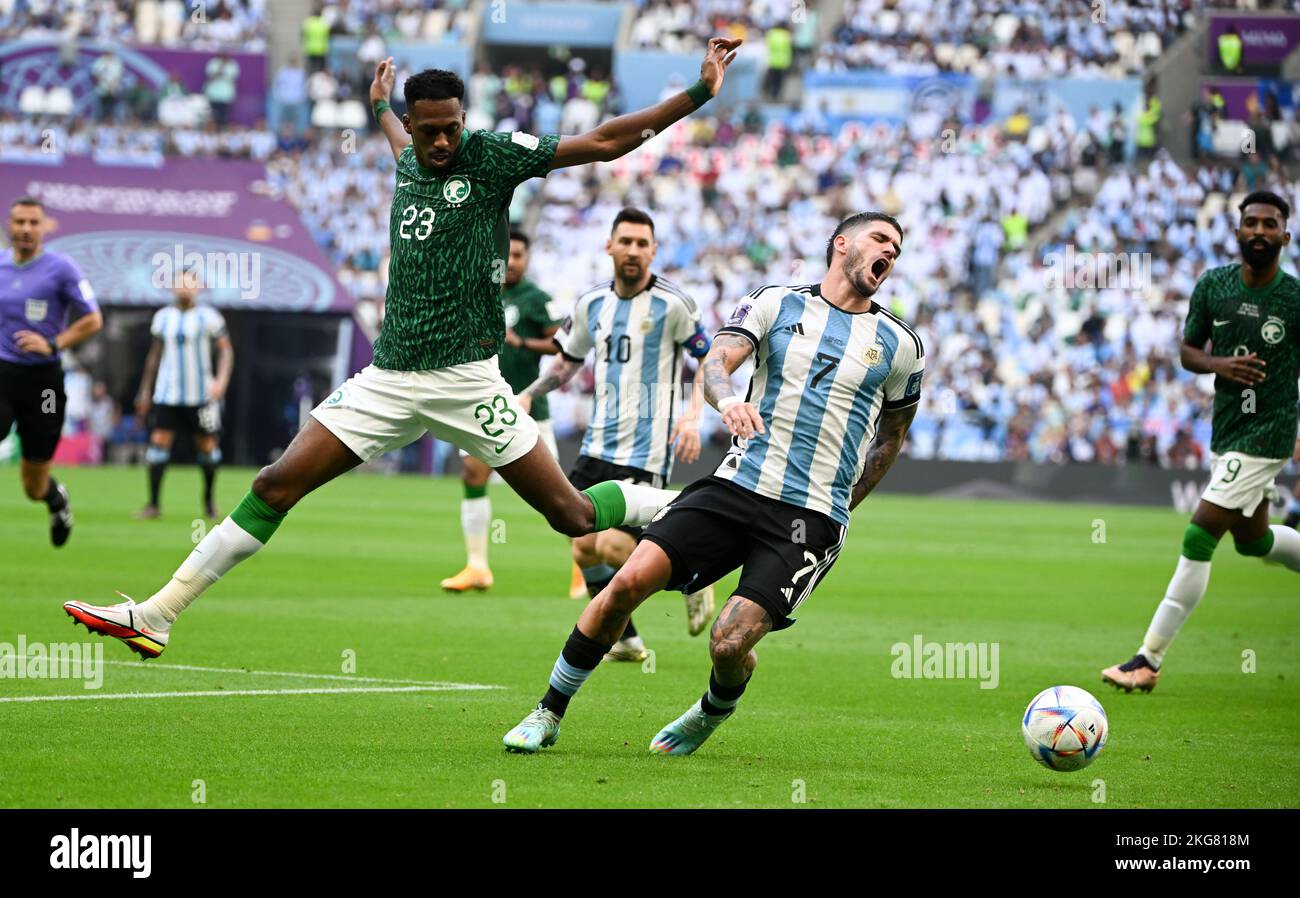 Lusail, Qatar. 22nd Nov, 2022. Mohamed Kanno (front L) of Saudi Arabia vies with Rodrigo de Paul (front R) of Argentina during the Group C match between Argentina and Saudi Arabia at the 2022 FIFA World Cup at Lusail Stadium in Lusail, Qatar, Nov. 22, 2022. Credit: Li Ga/Xinhua/Alamy Live News Stock Photo