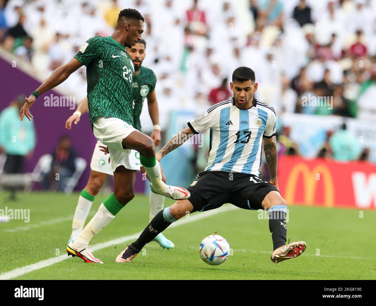 Lusail, Qatar. 22nd Nov, 2022. Mohamed Kanno (L) of Saudi Arabia vies with Cristian Romero (R) of Argentina during the Group C match between Argentina and Saudi Arabia at the 2022 FIFA World Cup at Lusail Stadium in Lusail, Qatar, Nov. 22, 2022. Credit: Han Yan/Xinhua/Alamy Live News Stock Photo