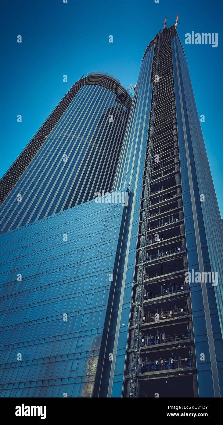 Construction of high-rise building. Construction cranes and skyscraper ...