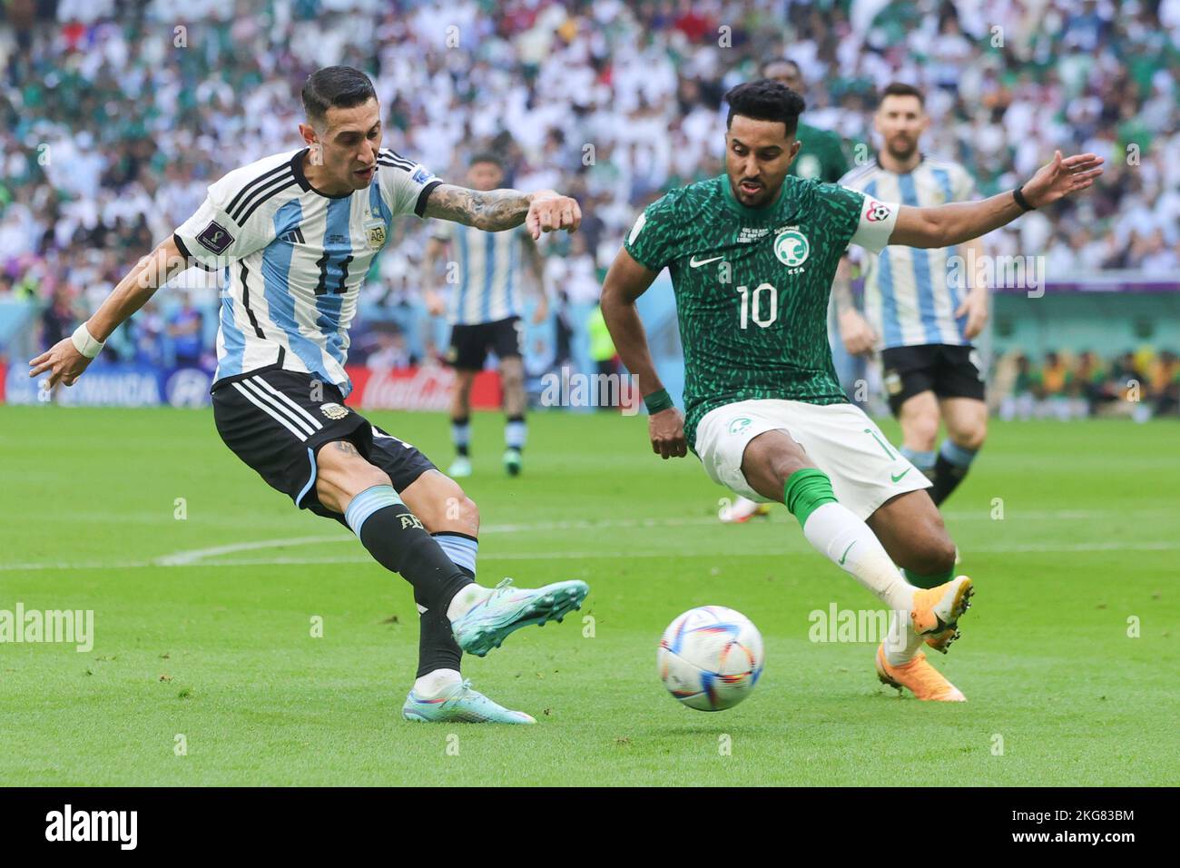 Lusail, Qatar. 22nd Nov, 2022. Angel Di Maria of Argentina attempts to cross the ball defended by Salem Aldawsari of Saudi Arabia during the FIFA World Cup Qatar 2022 Group C match between Argentina and Saudi Arabia at Lusail Stadium, Lusail, Qatar on 22 November 2022. Photo by Peter Dovgan. Editorial use only, license required for commercial use. No use in betting, games or a single club/league/player publications. Credit: UK Sports Pics Ltd/Alamy Live News Stock Photo