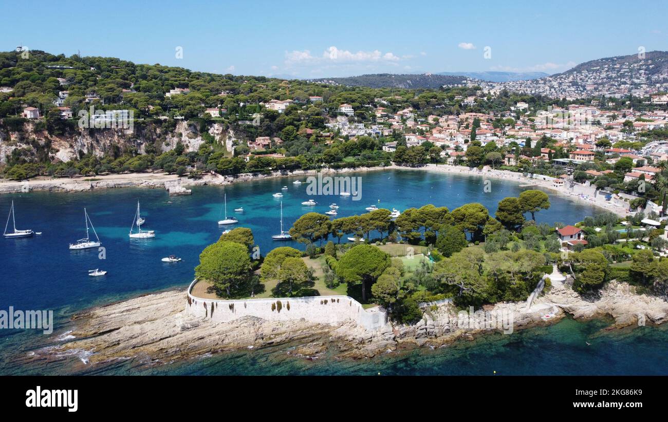 A breathtaking view of a river with boats in it next to a city in Nice ...