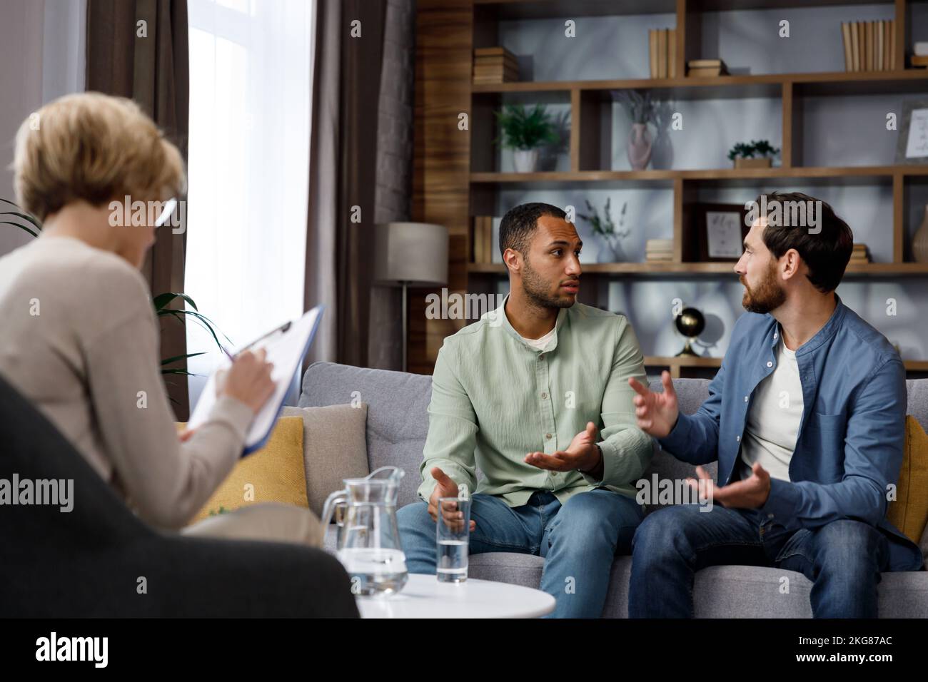 Family quarrel at the reception at the psychologist. LGBT couple at a