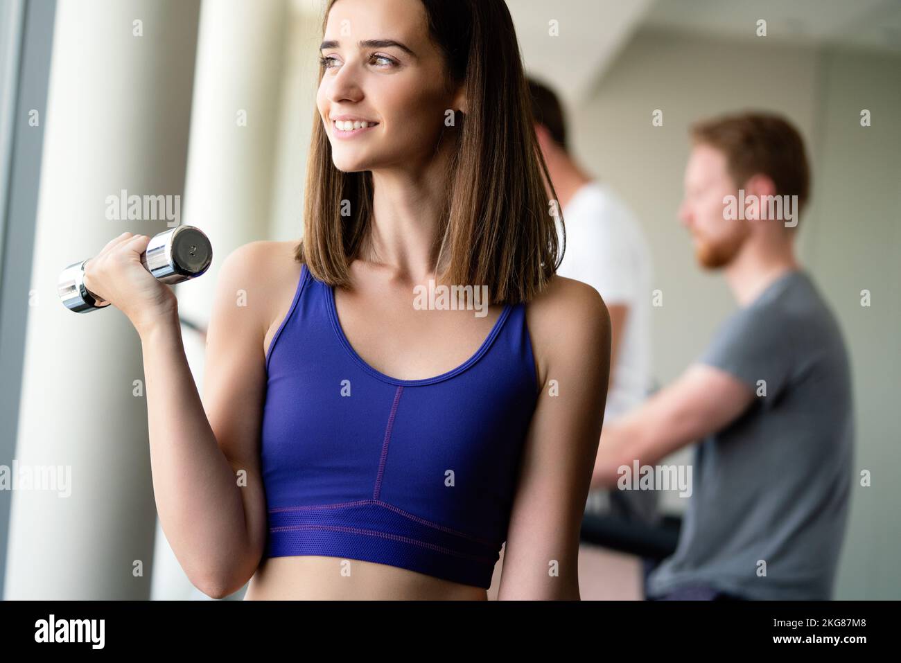 Beautiful fit women working out in gym to stay healthy Stock Photo