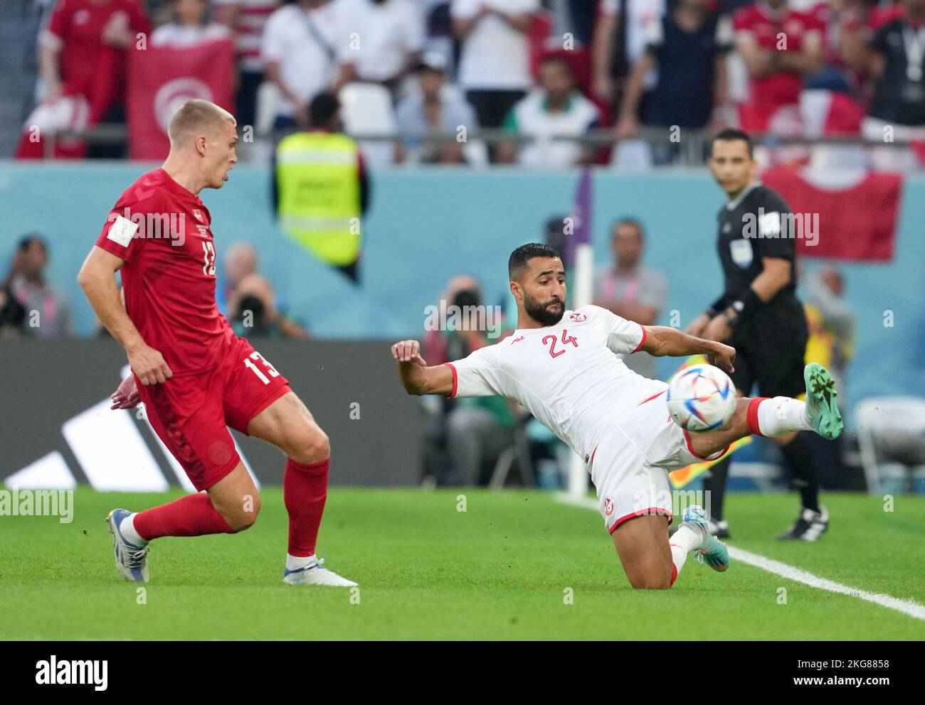 Al Rayyan, Qatar. 22nd Nov, 2022. Ali Abdi (R) of Tunisia competes against Rasmus Kristensen of Denmark during the Group D match between Denmark and Tunisia at the 2022 FIFA World Cup at Education City Stadium in Al Rayyan, Qatar, Nov. 22, 2022. Credit: Zheng Huansong/Xinhua/Alamy Live News Stock Photo