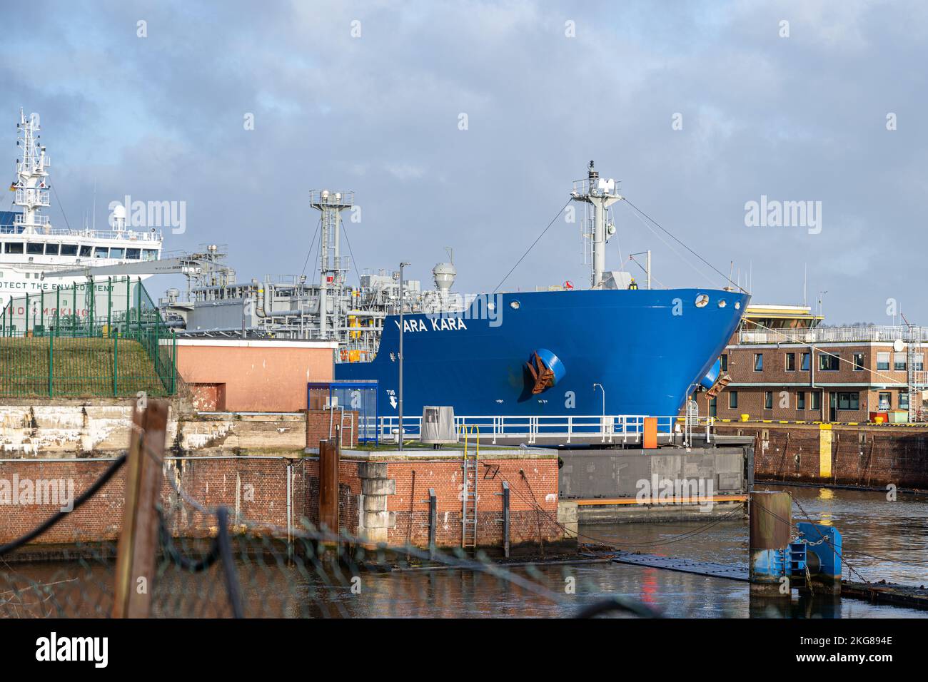 Kiel, Germany - February 22, 2022: A maritime vessel is leaving the Kiel Canal for the Baltic Sea. The Kiel Canal links the Baltic Sea with the North Sea Stock Photo