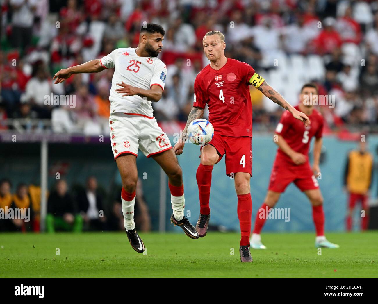 Al Rayyan, Qatar. 22nd Nov, 2022. Anis Ben Slimane (L) of Tunisia vies with Simon Kjaer of Denmark during the Group D match between Denmark and Tunisia at the 2022 FIFA World Cup at Education City Stadium in Al Rayyan, Qatar, Nov. 22, 2022. Credit: Xia Yifang/Xinhua/Alamy Live News Stock Photo